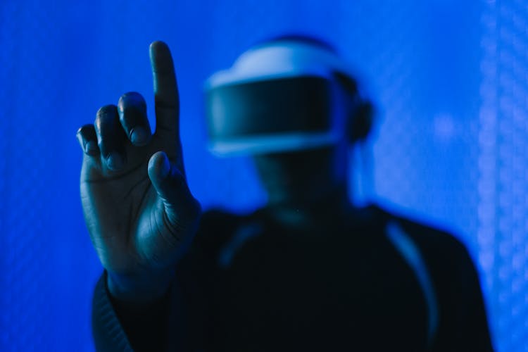 Close-up Of Man In VR Glasses Finger Touching 