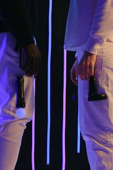 Two people holding VR controllers in a futuristic neon-lit setting.