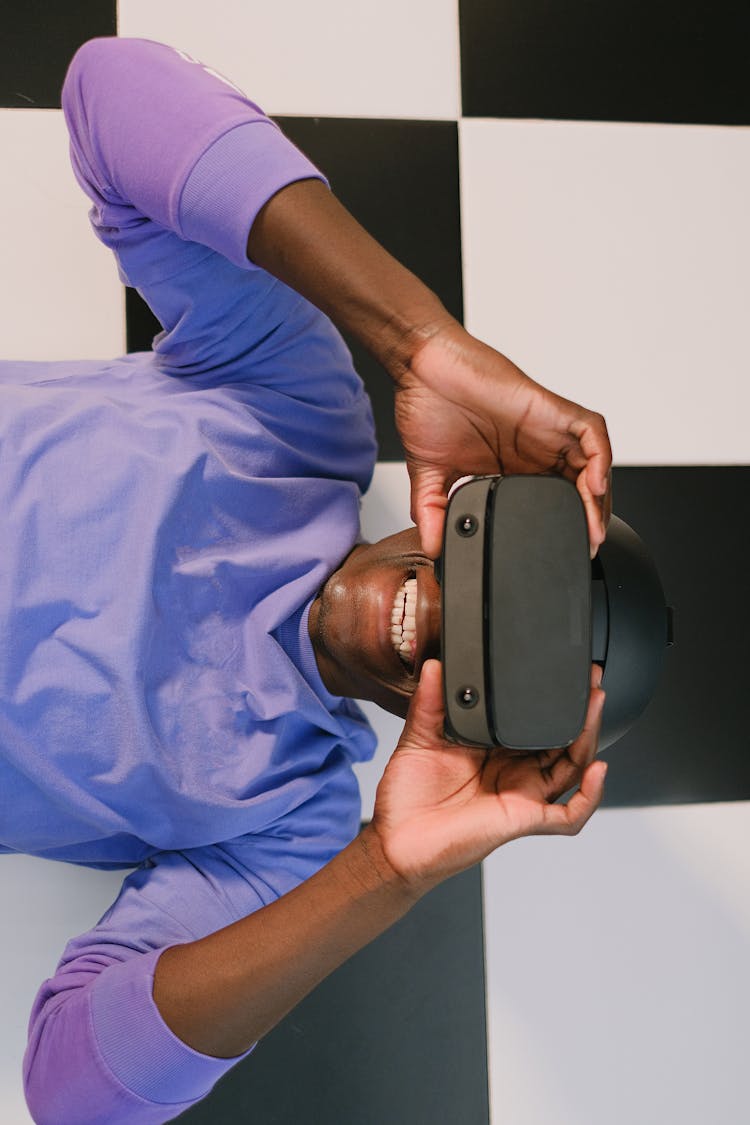 Smiling Man Trying VR Glasses