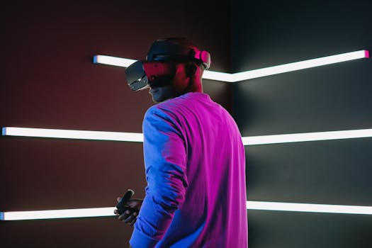 A man wearing a VR headset, engaged in a futuristic gaming environment with neon lights.