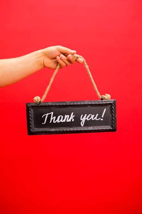 Free A Person Holding a Thank You Signage Stock Photo