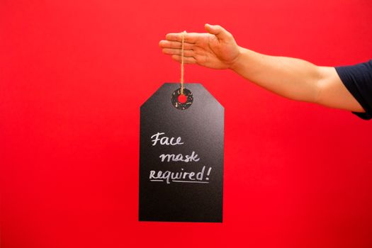A Person Holding a Hanging Signage