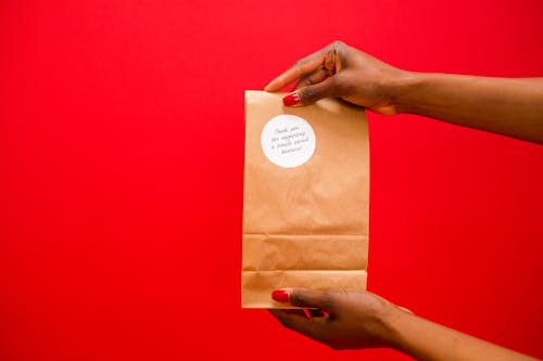 A Person Holding a Paper Bag