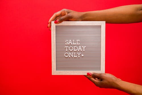 A Person Holding a Letter Board