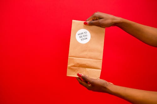 A Person Holding a Paper Bag