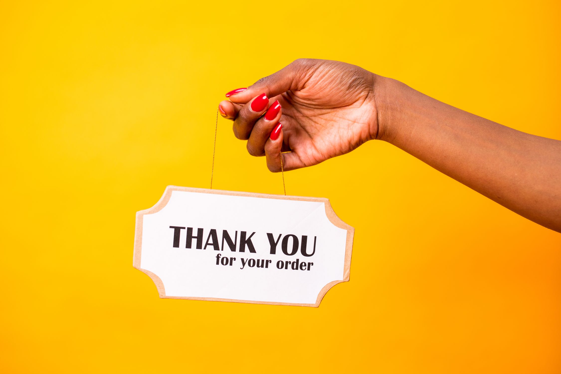 A Hand Holding a Signage · Free Stock Photo