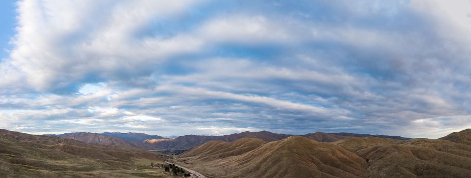 Breathtaking landscape of rocky mountains placed in countryside under cloudy sky in daytime