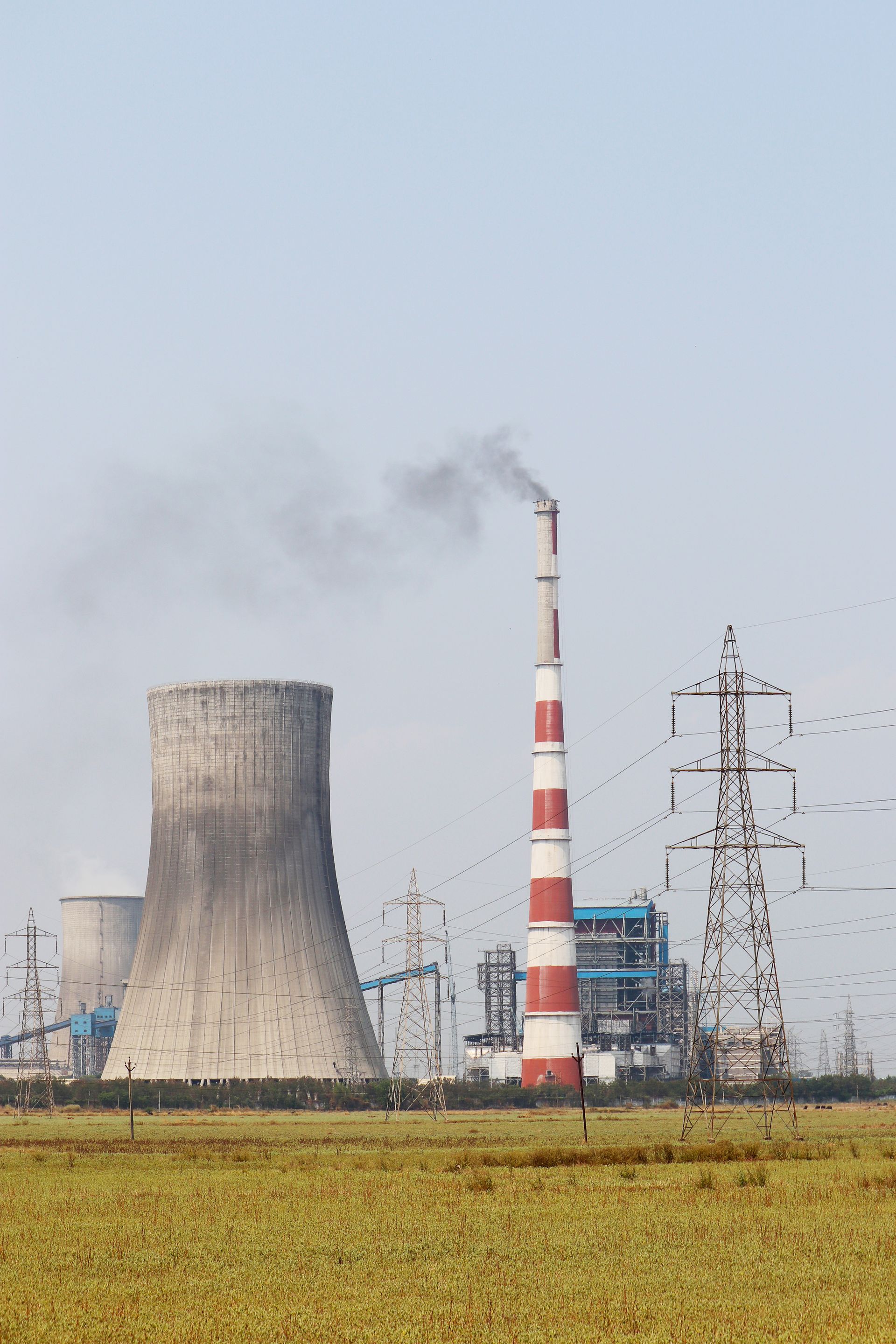 Thermal power plant with cooling towers and coal handling yard