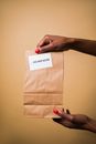 A Person Holding a Paper Bag