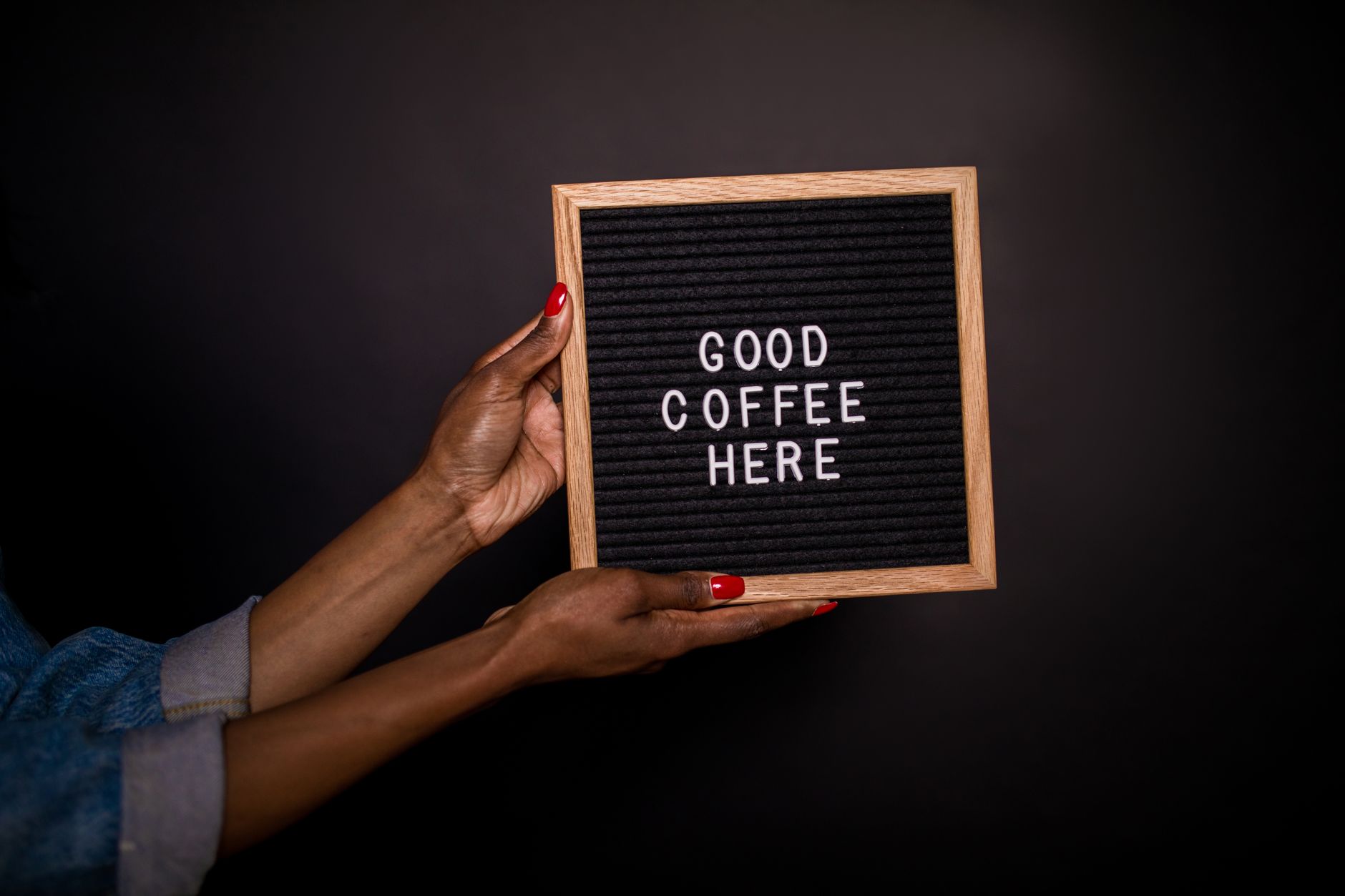 Person Holding a Sign Board