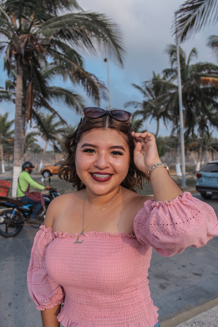 Portrait Of Smiling Girl With Braces Posing Outdoors