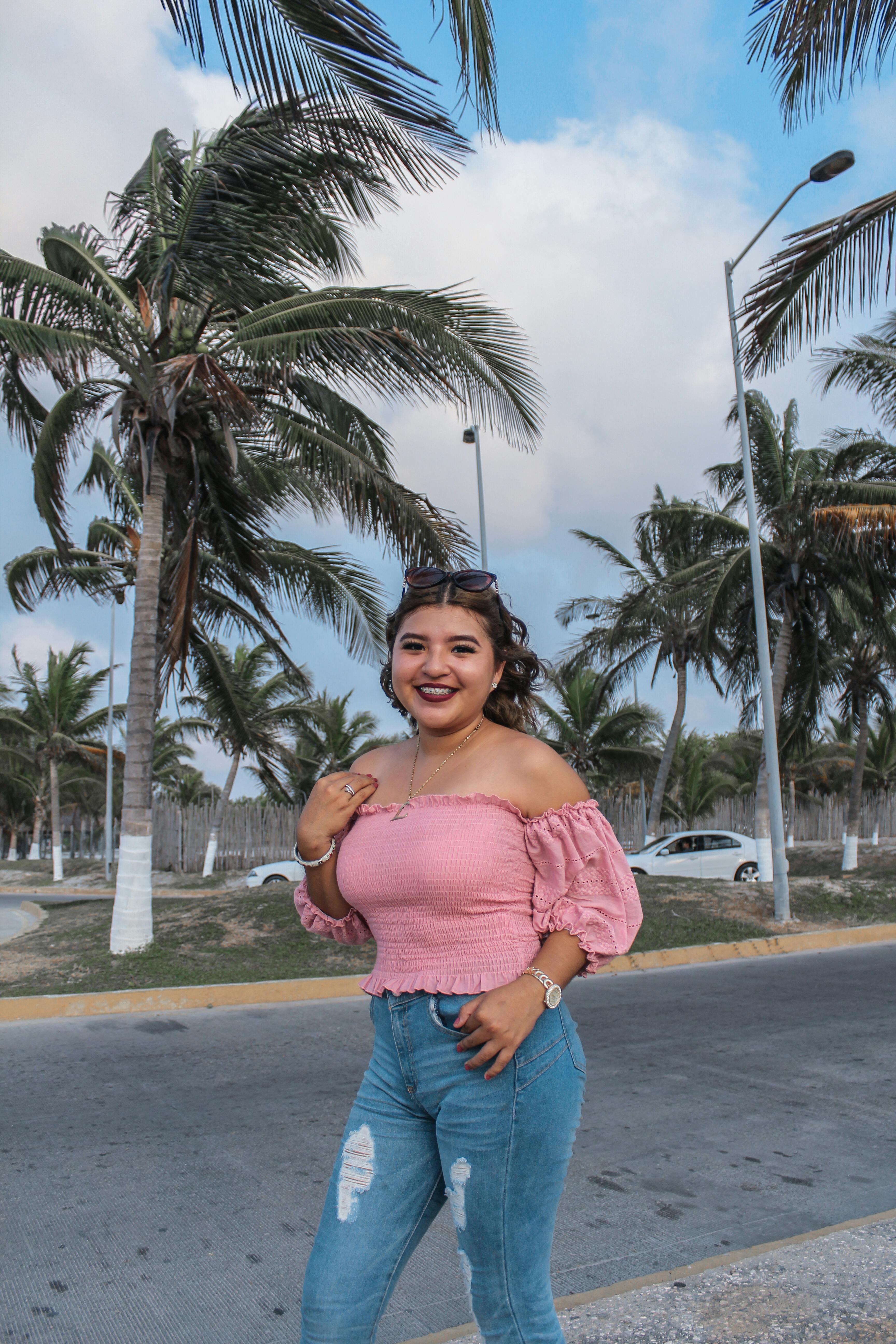 Photograph Of A Woman Wearing A White Crop Top And Denim Jeans · Free ...