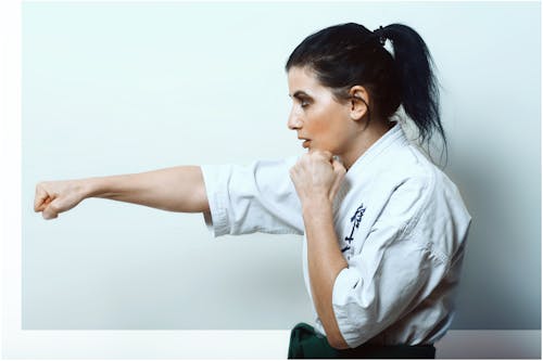 Karate woman punching in air