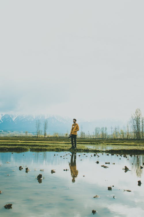 Man Standing on a Rice Paddy Field