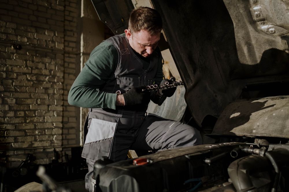 Mechanic working on a truck engine