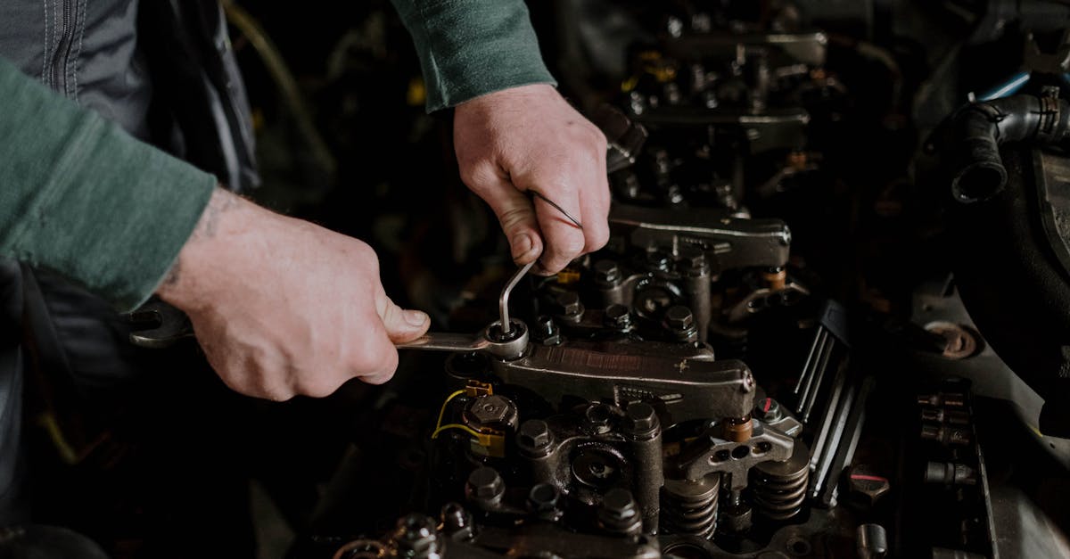 A Person Fixing a Machine · Free Stock Photo