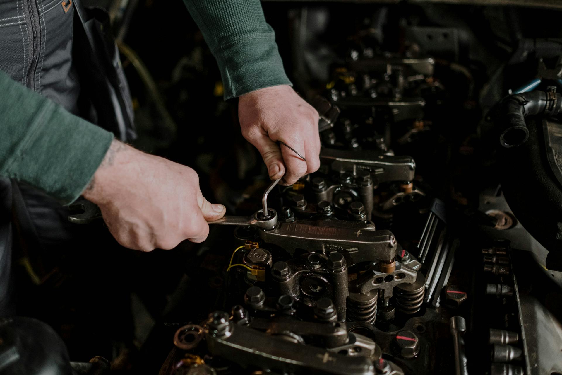 A Person Fixing a Machine