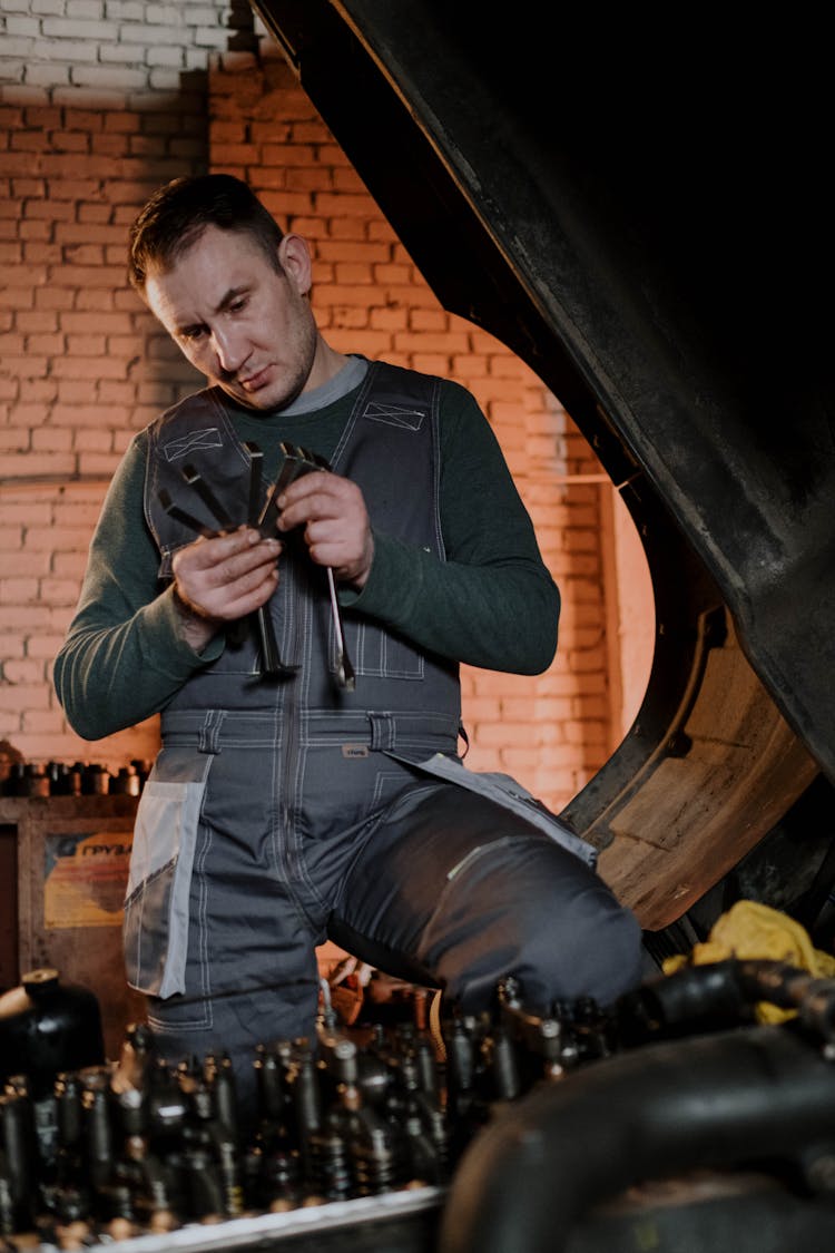 A Mechanic Tuning An Engine