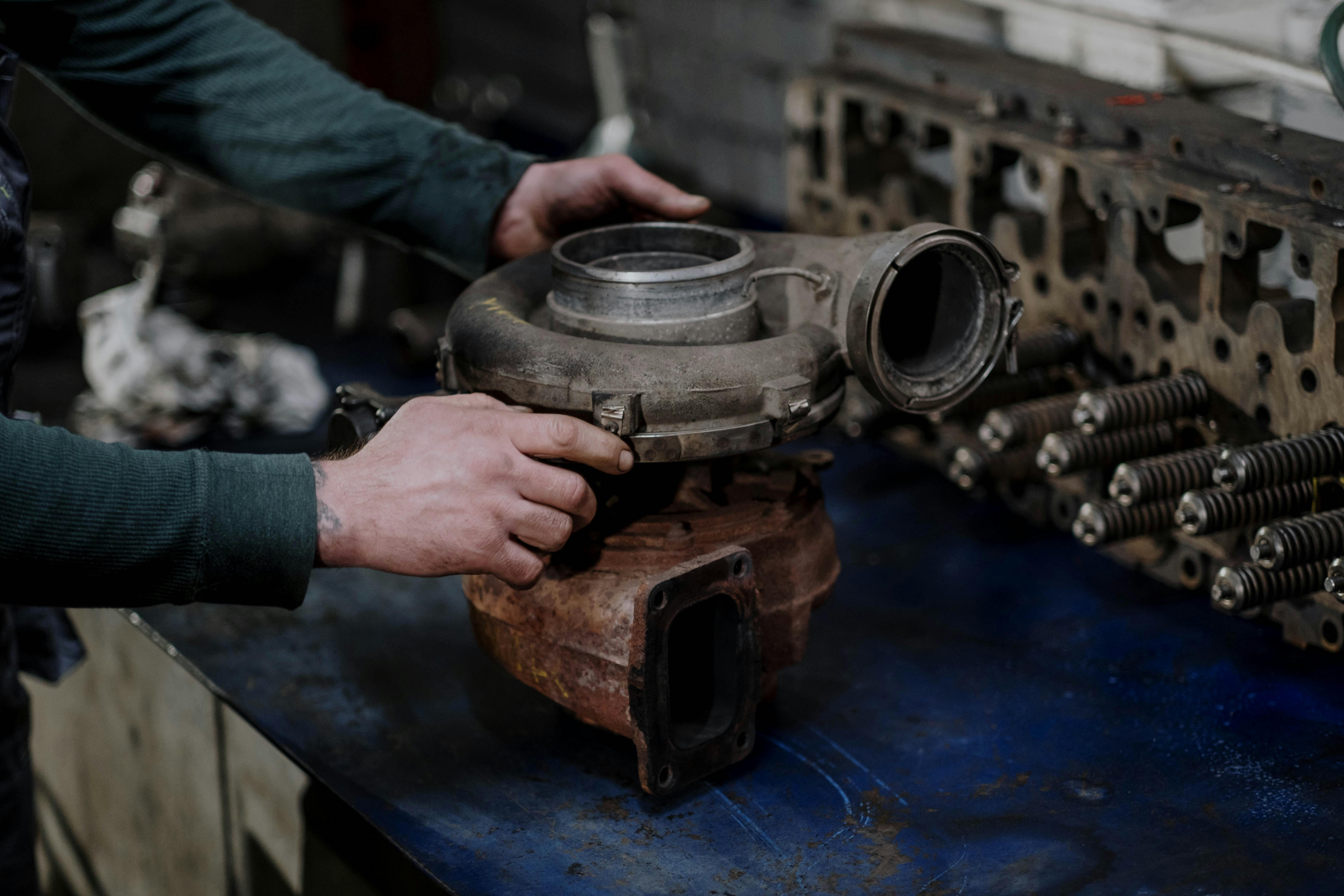 Person Holding a Engine Turbo