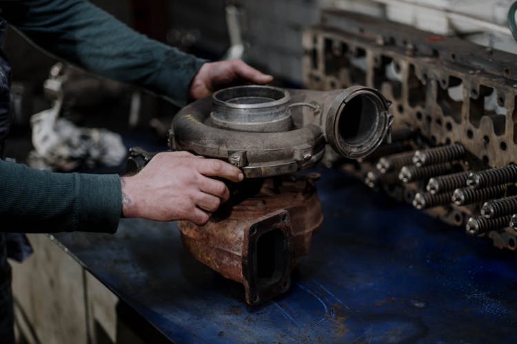 Person Holding A Engine Turbo