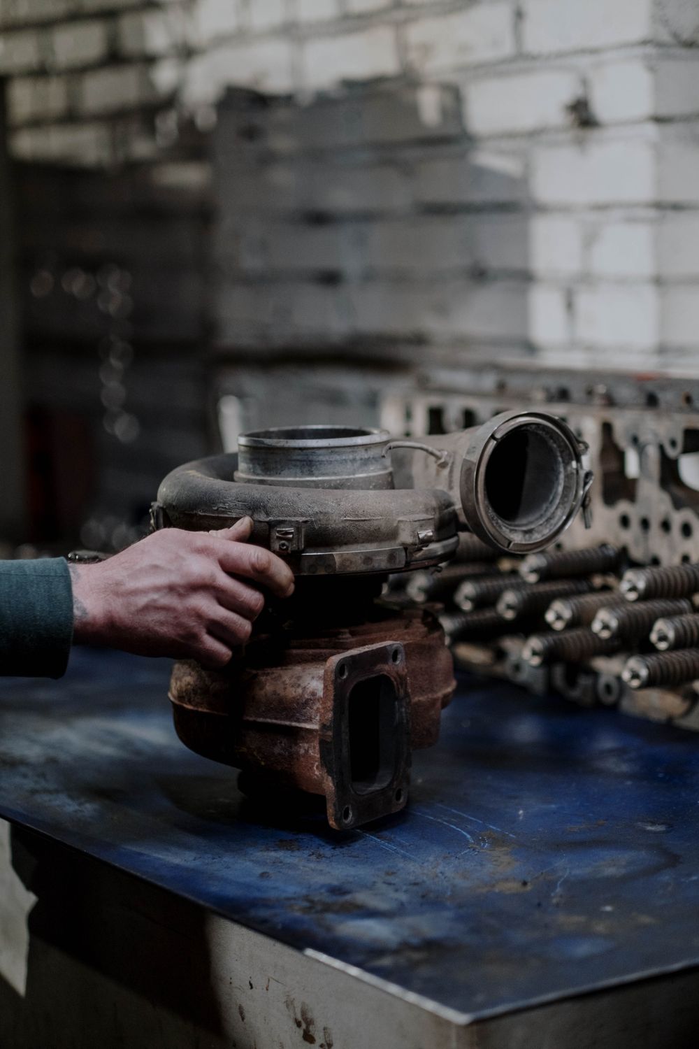 Turbocharger and diesel engine spare parts in a workshop — MTU marine and genset parts sourced by IWH