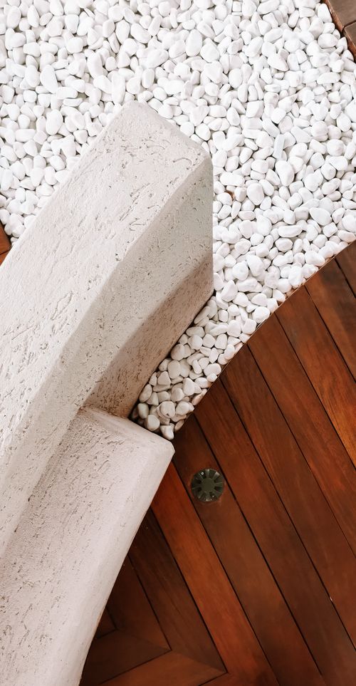 Natural stone and warm wood textures illustrating material craft