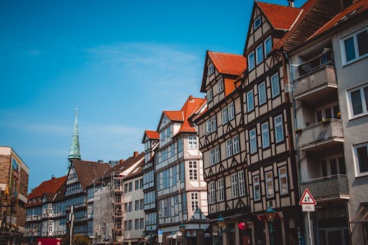 Scenic view of traditional half-timbered houses on a sunny day in Hanover, Germany. by Irina Iriser