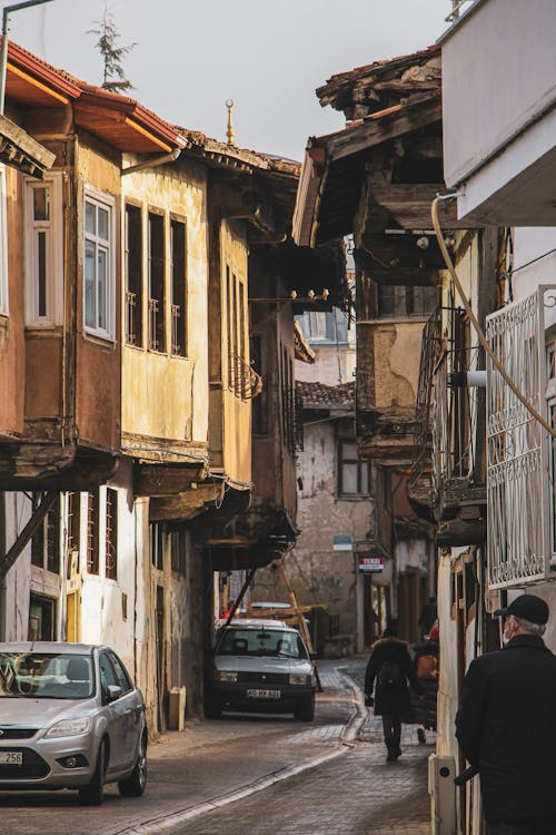 People Walking on a Narrow Street