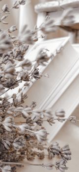 Artistic close-up of books with delicate dried flowers, captured in a soft focus for a dreamy effect.