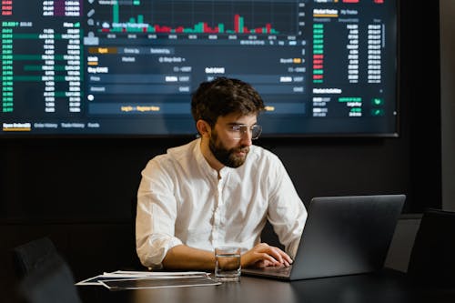 Free Man in White Dress Shirt Using Laptop Stock Photo