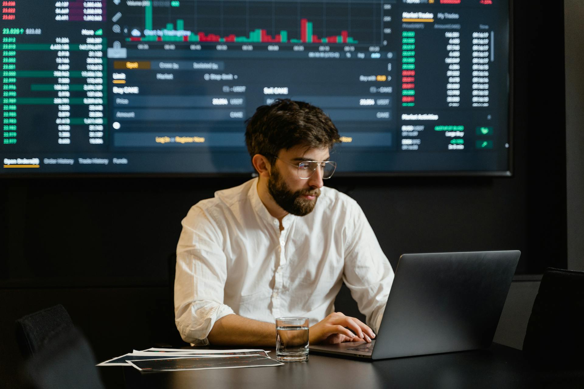 Man in White Dress Shirt Using Laptop