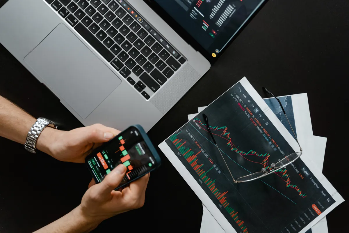 Futures trader analyzing consistency rule metrics across prop firm dashboards