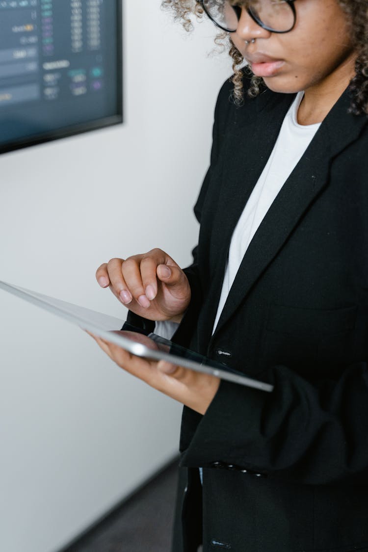 Photo Of A Woman Using A Tablet