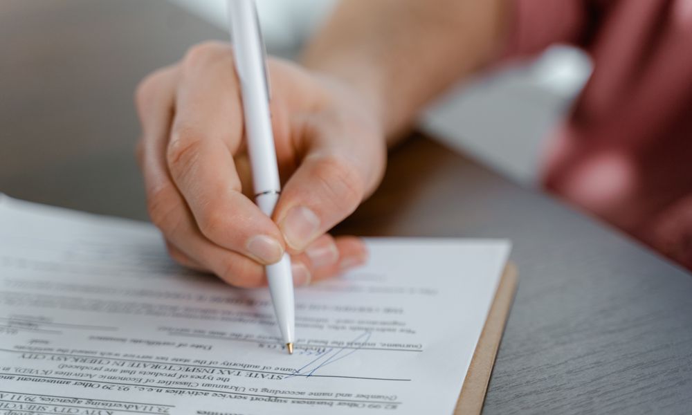 business traveler signing documents