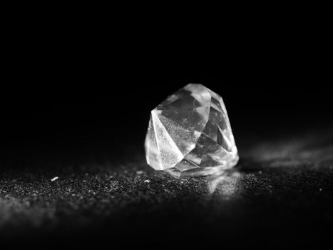 Macro shot showcasing a sparkling diamond's facets and clarity against a dark background.