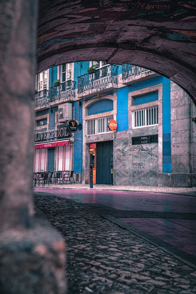 An Empty Arch Cobblestone Street