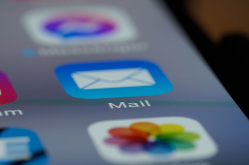 Detailed close-up of an email app icon on a smartphone screen, showcasing modern technology.