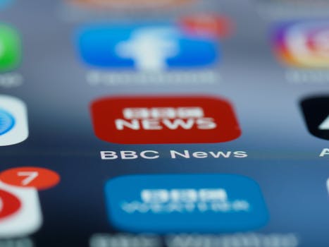 Macro shot of a smartphone screen displaying the BBC News app icon and notifications.