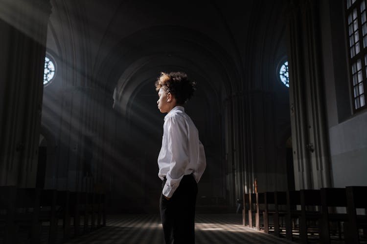 Photograph Of A Boy In A Church