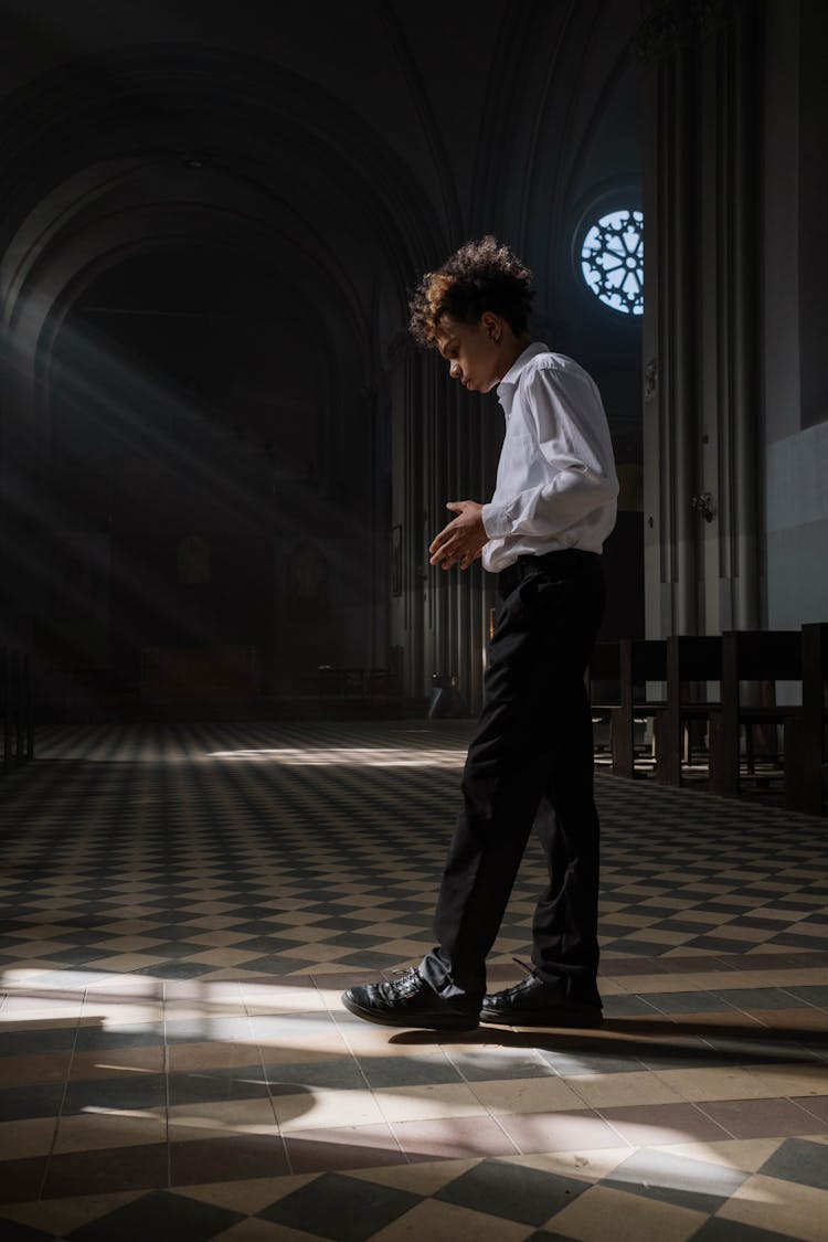 A Teenage Boy Inside A Church