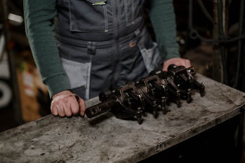 Close up of Man Working with Metal Items