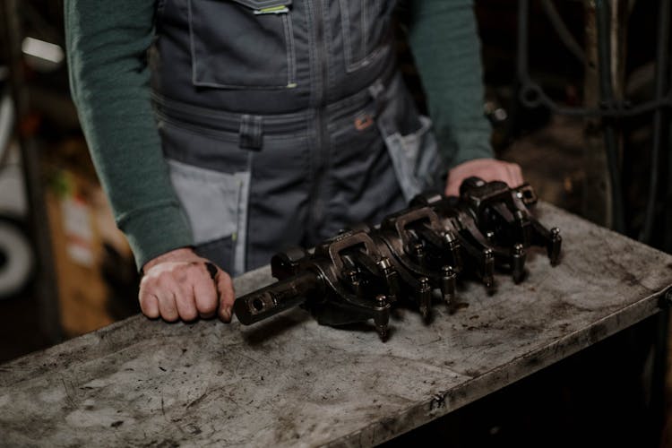 Close Up Of Man Working With Metal Items