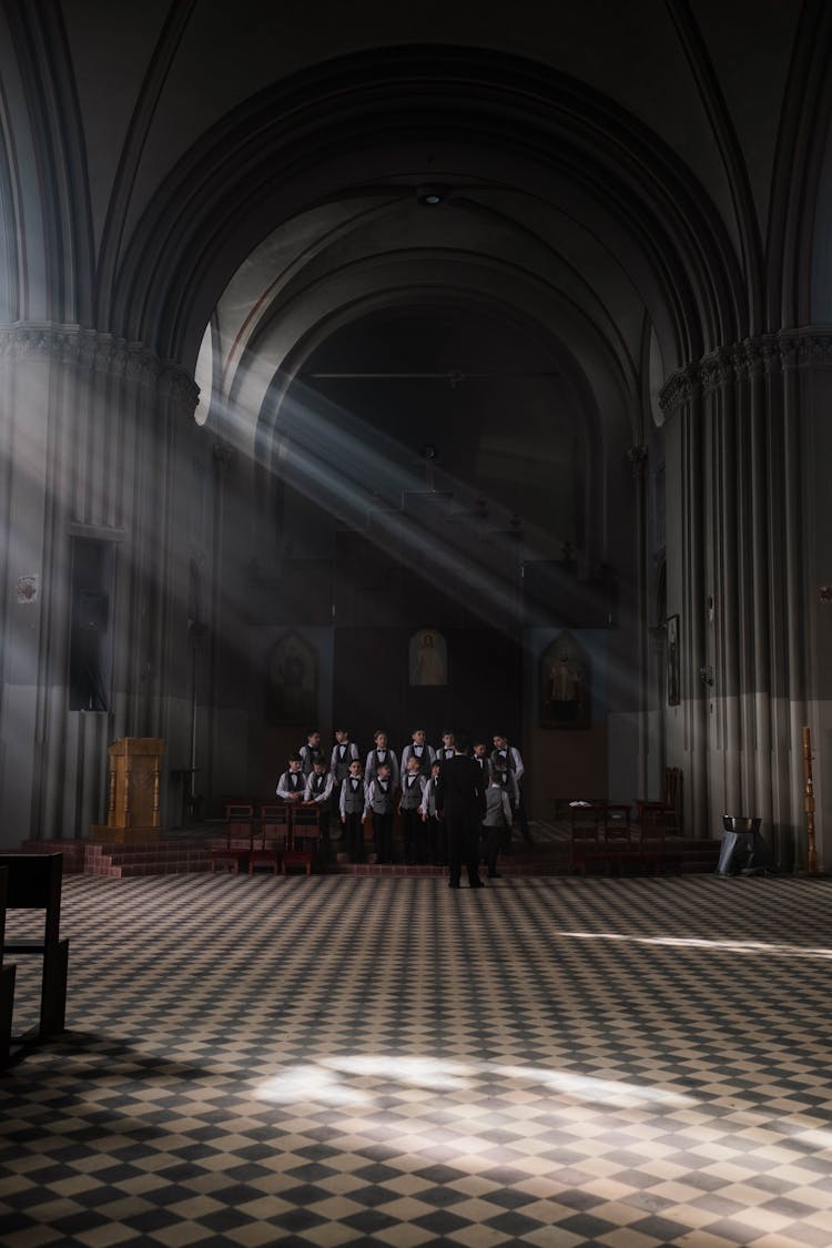 Group Of Boys In A Dark Room With Sun Rays