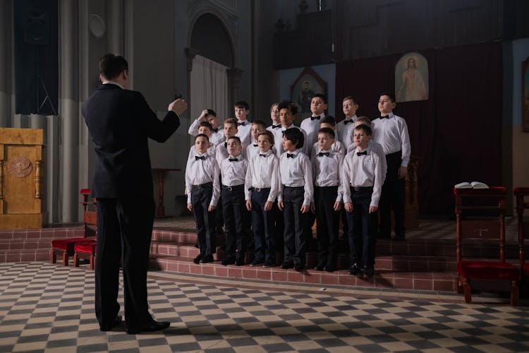 Group Of Boys In White Shirt And Black Bowtie