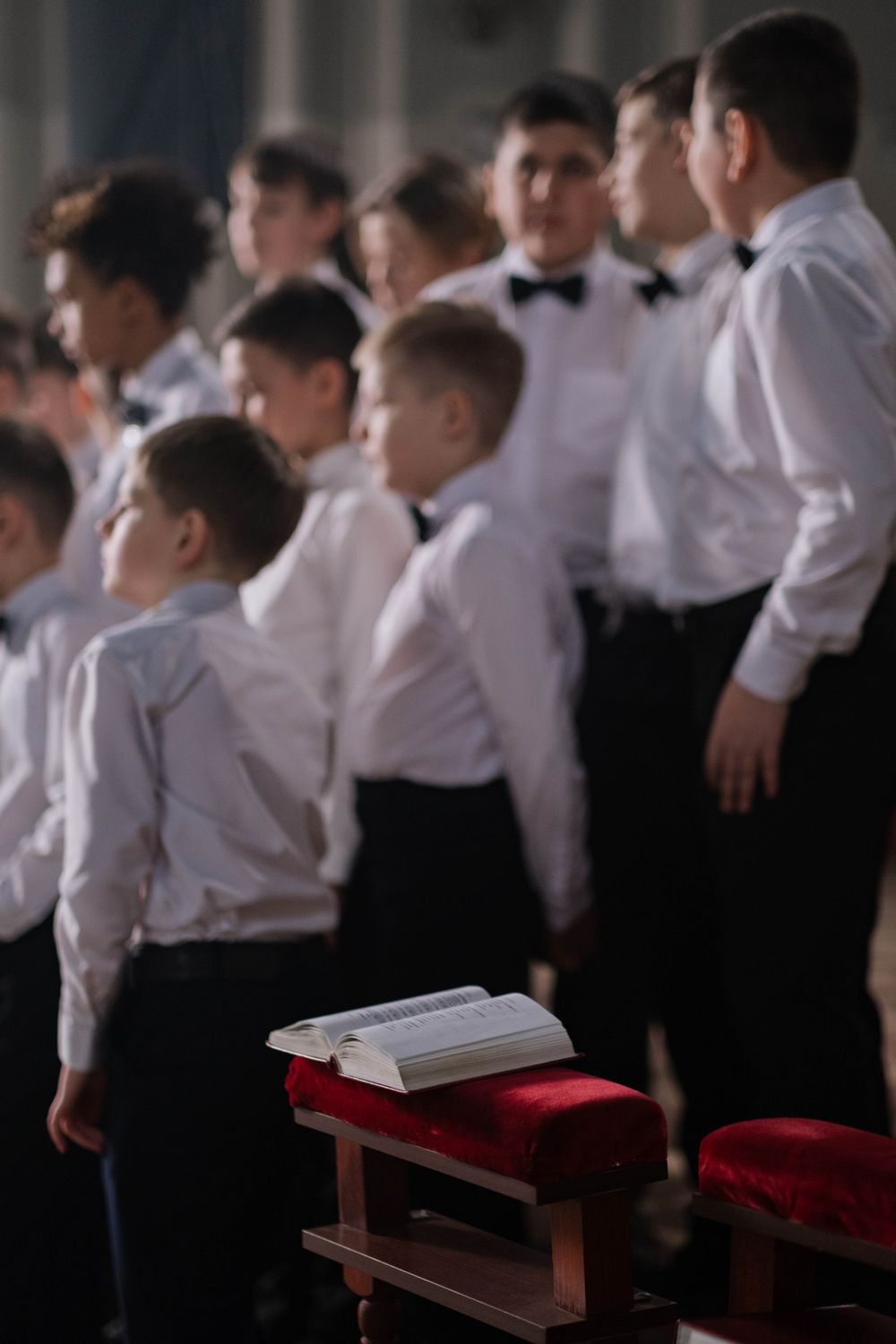 Group of young people singing together in a choir