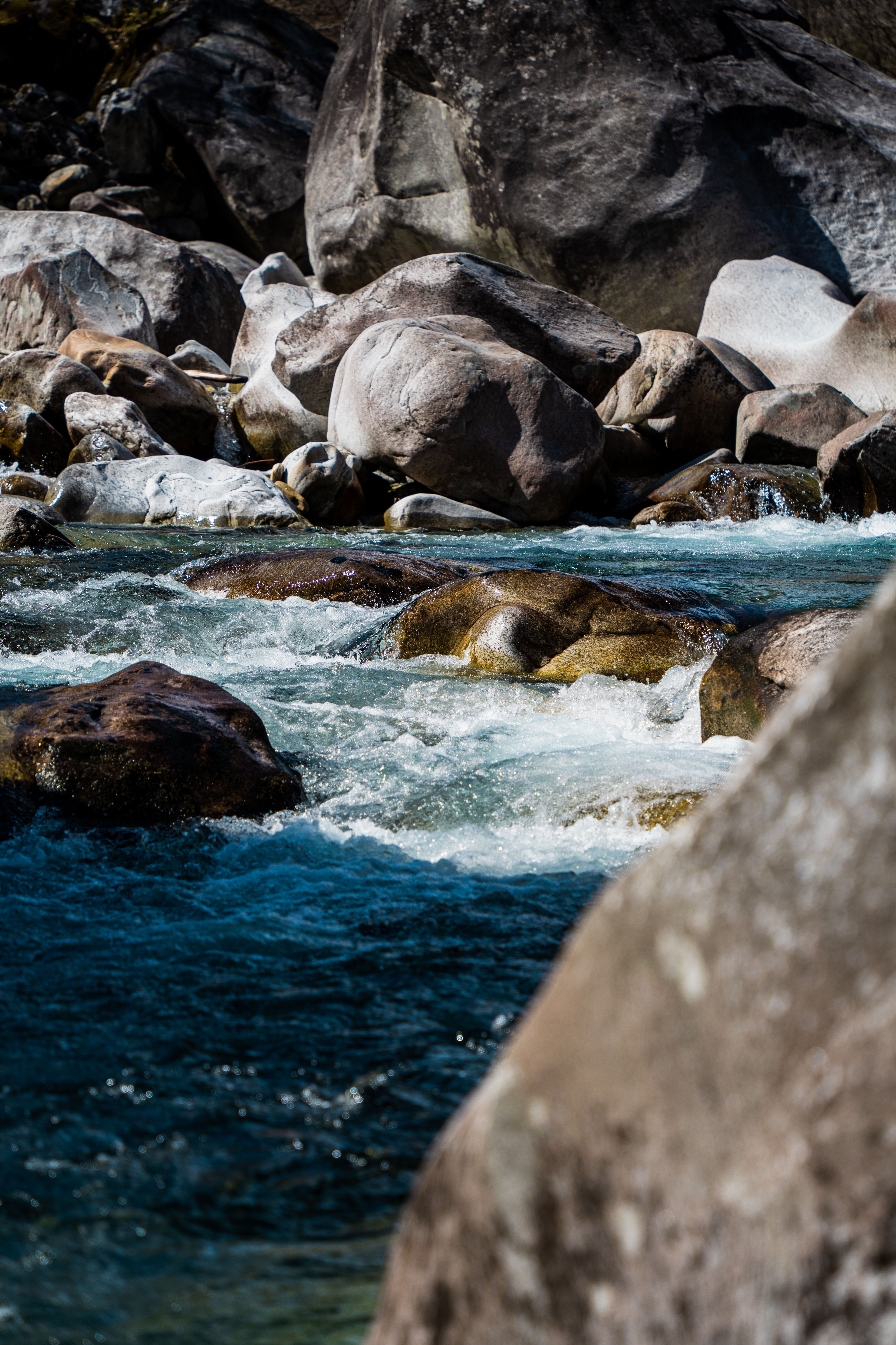 Gray Rocks on Body of Water · Free Stock Photo