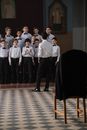 A Boys Choir Practicing Inside the Church