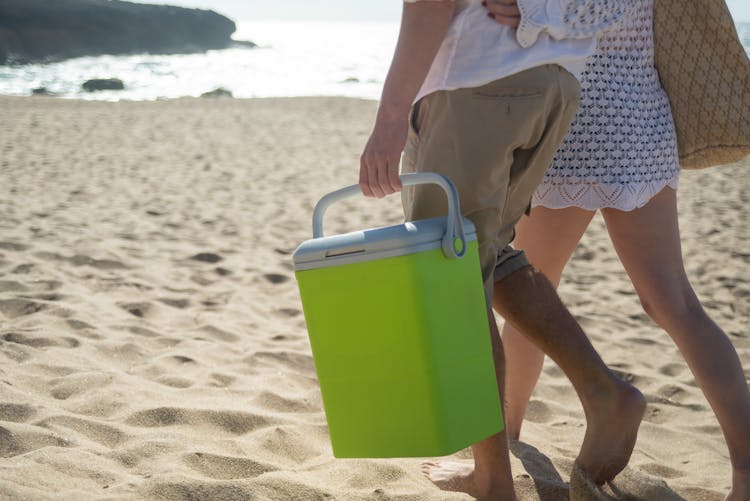 Hands Holding Neon Green Cooler