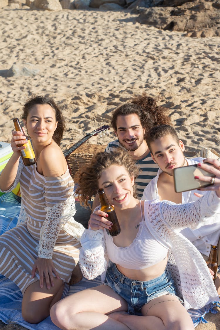 A Group Of Friends Taking Selfie At The Beach