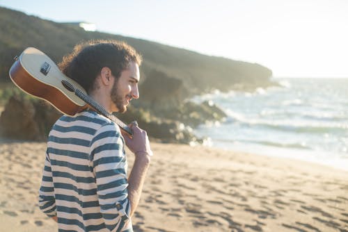 Free Man Holding Ukulele on His Shoulder Stock Photo